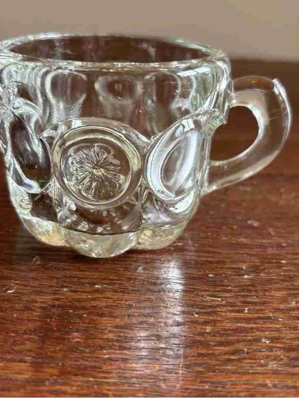 Clear Glass Teacup with Raised Medallion Design